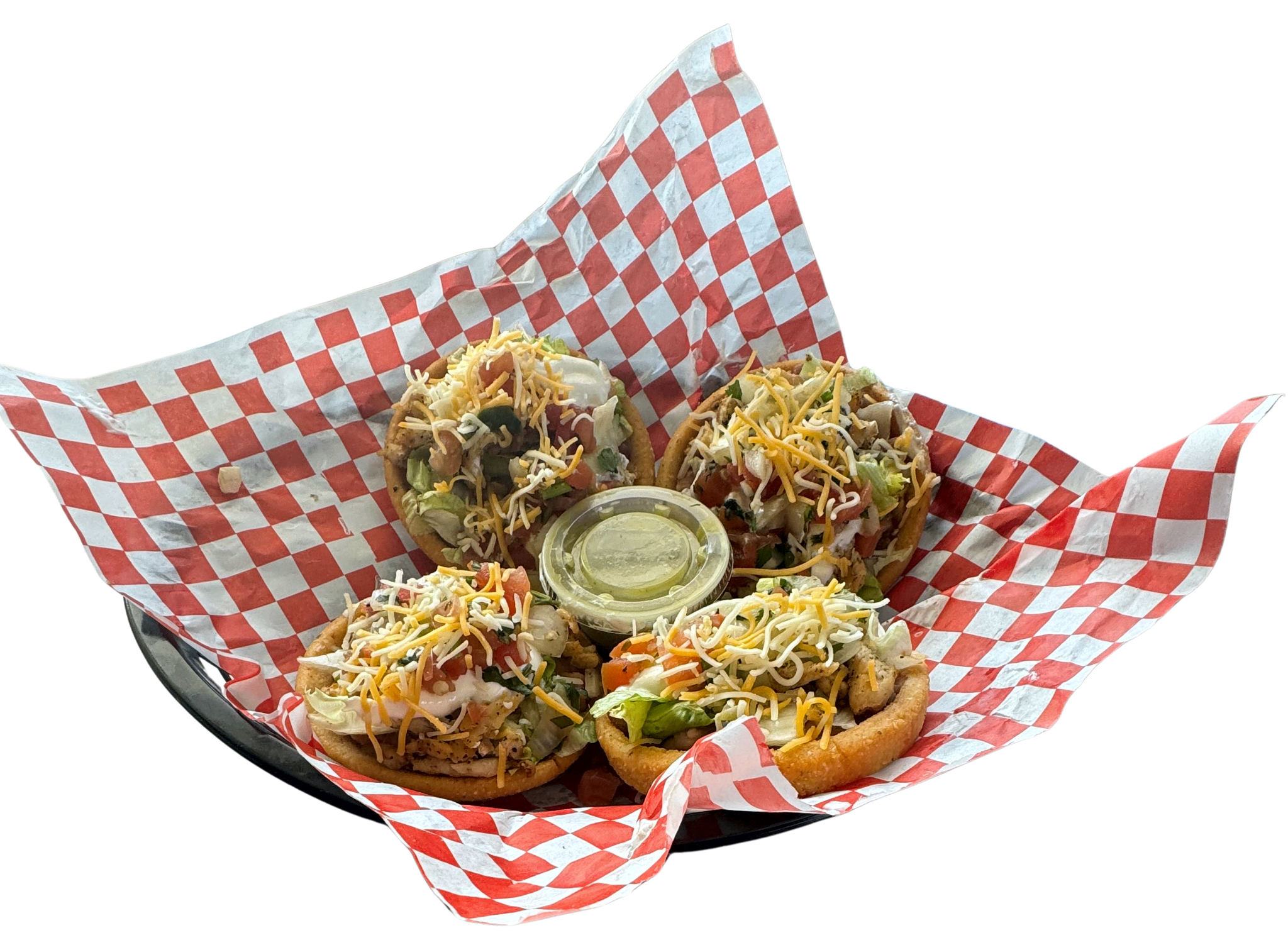 Sopes with meat, lettuce, beans, cream, and cheese